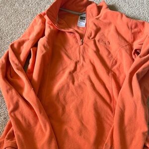 The north face women’s fleece women’s zip
Up orange medium